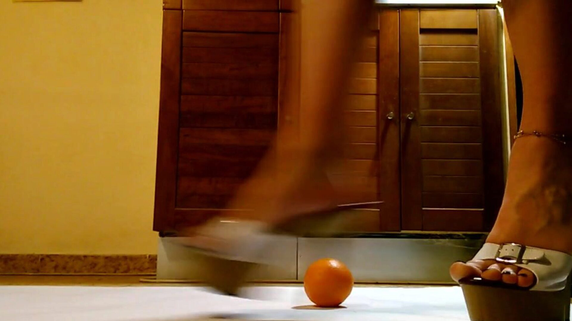 Waitress play and punch orange in hawt platform high-heeled shoes Waitress have fun and kick orange in sexy platform high-heeled shoes